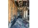 Significant fire damage inside the home, revealing damaged frames and debris at 1165 S Winona Ct, Denver, CO 80219