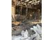 Devastating fire damage with debris and charred remains; requires extensive restoration at 1165 S Winona Ct, Denver, CO 80219
