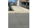 View of a long concrete driveway leading up to the house, capable of accommodating multiple vehicles at 1165 S Winona Ct, Denver, CO 80219