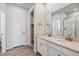 Bathroom boasts double sinks, granite countertops, and a glass shower enclosure at 25023 N 34Th Ave, Aurora, CO 80019