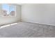 Bedroom with large window and neutral carpet at 25023 N 34Th Ave, Aurora, CO 80019