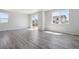 Bright living room with large windows and sliding glass door at 25023 N 34Th Ave, Aurora, CO 80019