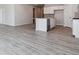 Open-concept kitchen and living area with hard surface floors at 25023 N 34Th Ave, Aurora, CO 80019