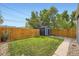 Fenced backyard featuring lush lawn, a shed for storage and landscape stone at 2540 Kendall St, Edgewater, CO 80214