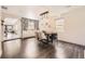 Bright dining room with wood floors, modern lighting, an open layout, and stylish chairs at 2540 Kendall St, Edgewater, CO 80214