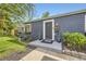 Charming home entrance with a gray door, manicured bushes, and clear, bright house number at 2540 Kendall St, Edgewater, CO 80214