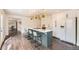 Stylish kitchen featuring a large center island with quartz countertop, and stainless steel appliances at 2540 Kendall St, Edgewater, CO 80214