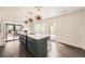 Bright, modern kitchen with a large island and seamlessly connects to the living area at 2540 Kendall St, Edgewater, CO 80214