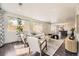 Bright living room featuring dark floors, modern furnishings, and an open layout at 2540 Kendall St, Edgewater, CO 80214