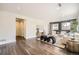 This bright living room features hardwood floors, modern decor, and black accent wall at 2540 Kendall St, Edgewater, CO 80214
