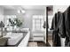 Modern bathroom featuring a double vanity, walk-in shower, and stylish fixtures at 2383 Jasmine St, Denver, CO 80207