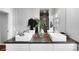 Bright bathroom featuring double sinks, modern fixtures, and stylish decor, enhancing the luxurious feel of the space at 2383 Jasmine St, Denver, CO 80207