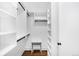 Spacious walk-in closet with custom shelving and ample storage, offering a practical and organized space at 2383 Jasmine St, Denver, CO 80207