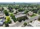 A beautiful aerial view of a residential area showcasing lush greenery and nearby city views at 3482 E 28Th Ave, Denver, CO 80205