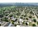 Scenic aerial shot showcasing the community, green spaces and a distant skyline view at 3482 E 28Th Ave, Denver, CO 80205