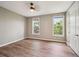 Bedroom showcasing hardwood floors, two windows, ceiling fan, and neutral wall color at 3482 E 28Th Ave, Denver, CO 80205