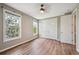 Bedroom showcasing hardwood floors, natural light from two windows, and a closet at 3482 E 28Th Ave, Denver, CO 80205