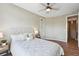 Comfortable bedroom with a ceiling fan, neutral walls, and wood flooring at 3482 E 28Th Ave, Denver, CO 80205