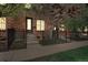 Charming brick townhouse with front porch, fenced yard, and a well-lit entryway at 3482 E 28Th Ave, Denver, CO 80205