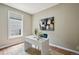 Home office with a modern white desk, stylish decor, and ample natural light at 3482 E 28Th Ave, Denver, CO 80205