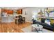 A well-lit living room features hardwood floors, modern furnishings, and an open floor plan at 3482 E 28Th Ave, Denver, CO 80205