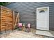 Charming patio area with stylish outdoor seating, decorative lights, and a private fence at 3482 E 28Th Ave, Denver, CO 80205