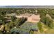 Aerial view showcases the community recreation center including swimming pool and multiple tennis and pickleball courts at 8406 Pebble Creek Way # 202, Highlands Ranch, CO 80126