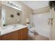 Well-lit bathroom with a single sink, vanity, and a shower-tub combination at 8406 Pebble Creek Way # 202, Highlands Ranch, CO 80126