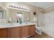 Bathroom with double vanity and shower-tub combo at 8406 Pebble Creek Way # 202, Highlands Ranch, CO 80126