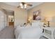 Bright bedroom with an ensuite bathroom, featuring large windows providing natural light and creating a calm and serene atmosphere at 8406 Pebble Creek Way # 202, Highlands Ranch, CO 80126
