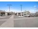 Exterior view of condo complex featuring covered parking spaces at 8406 Pebble Creek Way # 202, Highlands Ranch, CO 80126