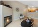 Cozy living room featuring fireplace, light wood floors, and decorative accents at 8406 Pebble Creek Way # 202, Highlands Ranch, CO 80126