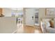 Inviting living room with light-colored wood floors and neutral paint provides a calming backdrop at 8406 Pebble Creek Way # 202, Highlands Ranch, CO 80126