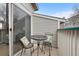 Cozy patio space with table and chairs for relaxing outdoors at 8406 Pebble Creek Way # 202, Highlands Ranch, CO 80126