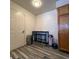 Cozy breakfast nook with table, two stools, and laminate flooring at 5898 W Asbury Pl, Lakewood, CO 80227