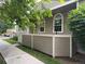 Townhouse featuring a cozy, fenced patio area with well-maintained landscaping at 5898 W Asbury Pl, Lakewood, CO 80227