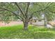 Lush backyard with mature trees providing ample shade, perfect for outdoor activities and relaxation at 2565 S Gaylord St, Denver, CO 80210