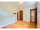 Neutral bedroom with hardwood flooring, a ceiling fan, and closet at 2565 S Gaylord St, Denver, CO 80210