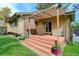 Back porch featuring an awning and a small deck with a door leading inside at 8866 E Easter Ave, Centennial, CO 80112