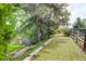 Fenced-in backyard featuring mature trees and landscaping at 8866 E Easter Ave, Centennial, CO 80112