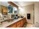 Bathroom features updated countertops and sink fixtures with decorative shelves at 8866 E Easter Ave, Centennial, CO 80112