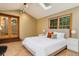 Bright bedroom featuring vaulted ceilings, skylight, double doors and a neutral color palette at 8866 E Easter Ave, Centennial, CO 80112