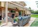 Covered patio with ceiling fan, outdoor seating and dining area perfect for entertaining and relaxing at 8866 E Easter Ave, Centennial, CO 80112