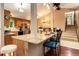 Bright and airy kitchen with granite counters, stainless steel appliances, and breakfast bar seating at 8866 E Easter Ave, Centennial, CO 80112