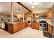 Open kitchen with granite countertops, stainless appliances, and ample cabinet space at 8866 E Easter Ave, Centennial, CO 80112