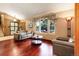 Cozy living room featuring hardwood floors, plush seating, and bright natural light at 8866 E Easter Ave, Centennial, CO 80112