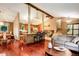 Inviting living room featuring hardwood floors, open layout, and seamless flow to the kitchen at 8866 E Easter Ave, Centennial, CO 80112