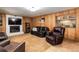 Comfortable living room with a fireplace, bar area and neutral carpeting creates a relaxing atmosphere at 8866 E Easter Ave, Centennial, CO 80112