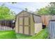 Backyard shed with double doors offers additional storage space for tools and equipment at 8866 E Easter Ave, Centennial, CO 80112