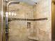 Walk in shower with decorative tile at 8866 E Easter Ave, Centennial, CO 80112